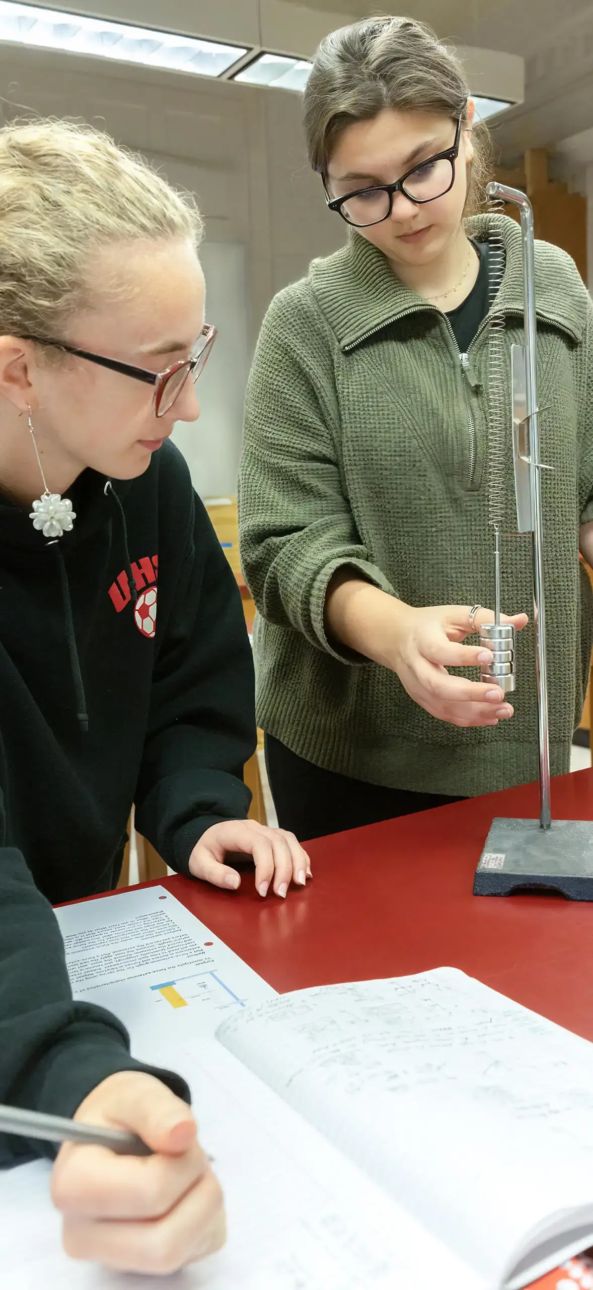 two girls making a measurement