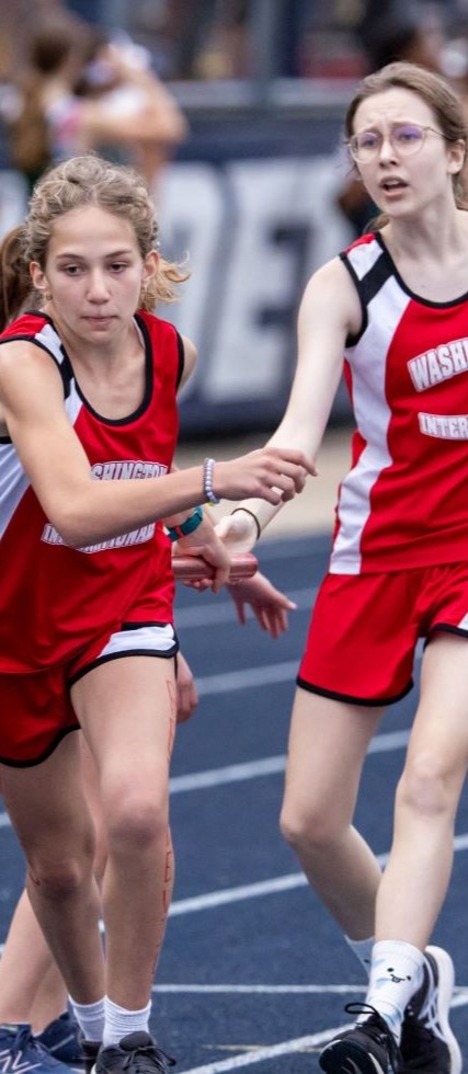 Students running in a relay