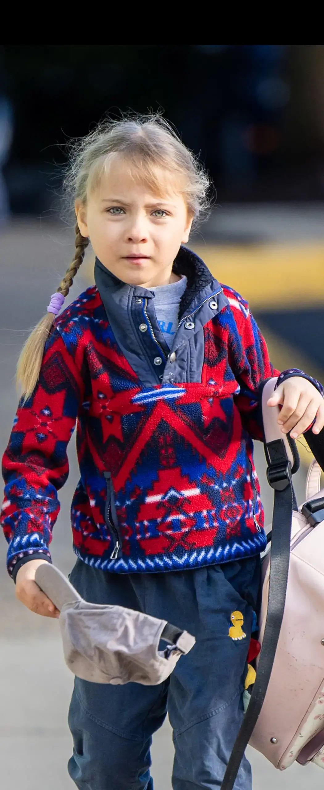 little girl with large backpack