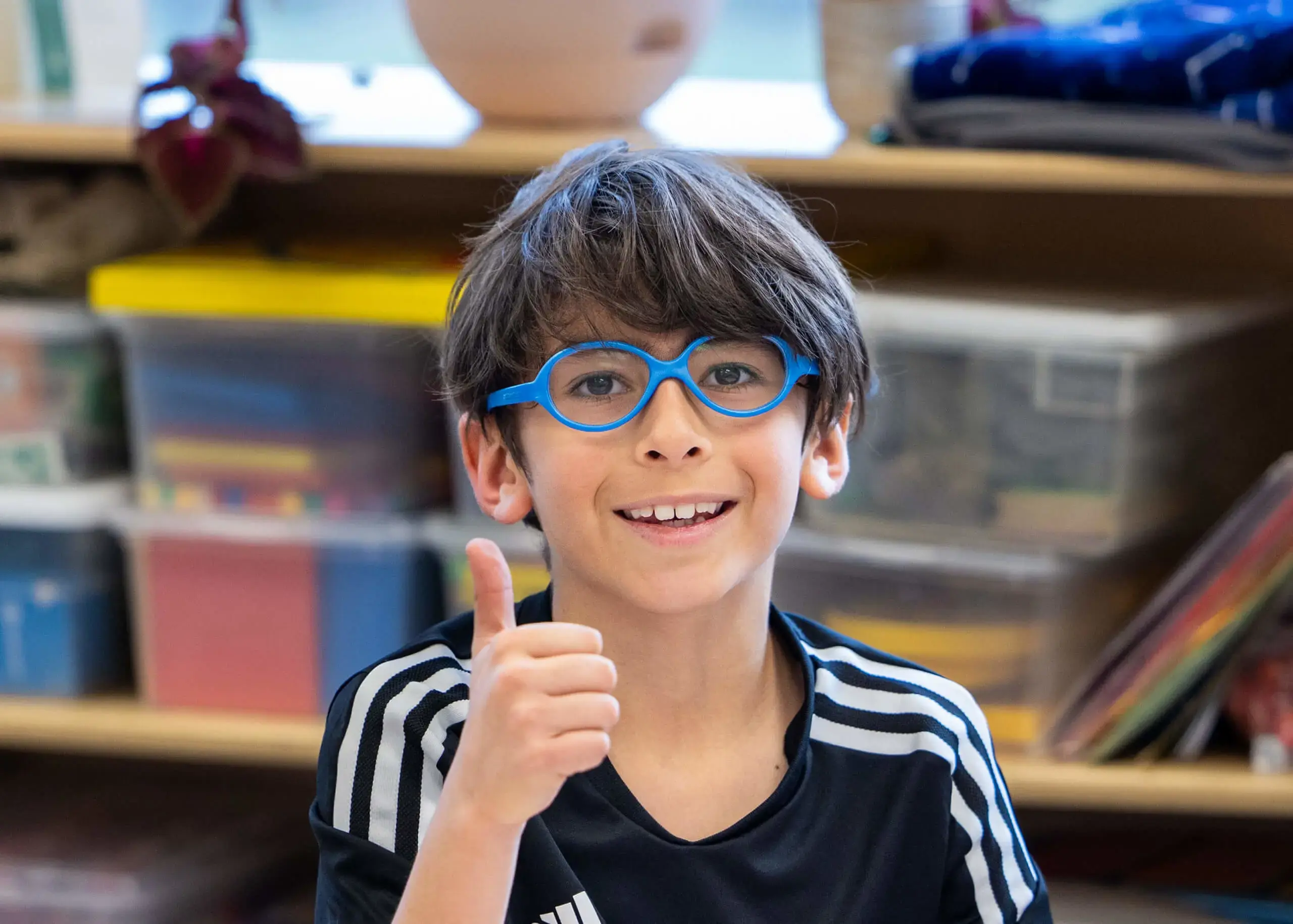 boy wearing blue glasses