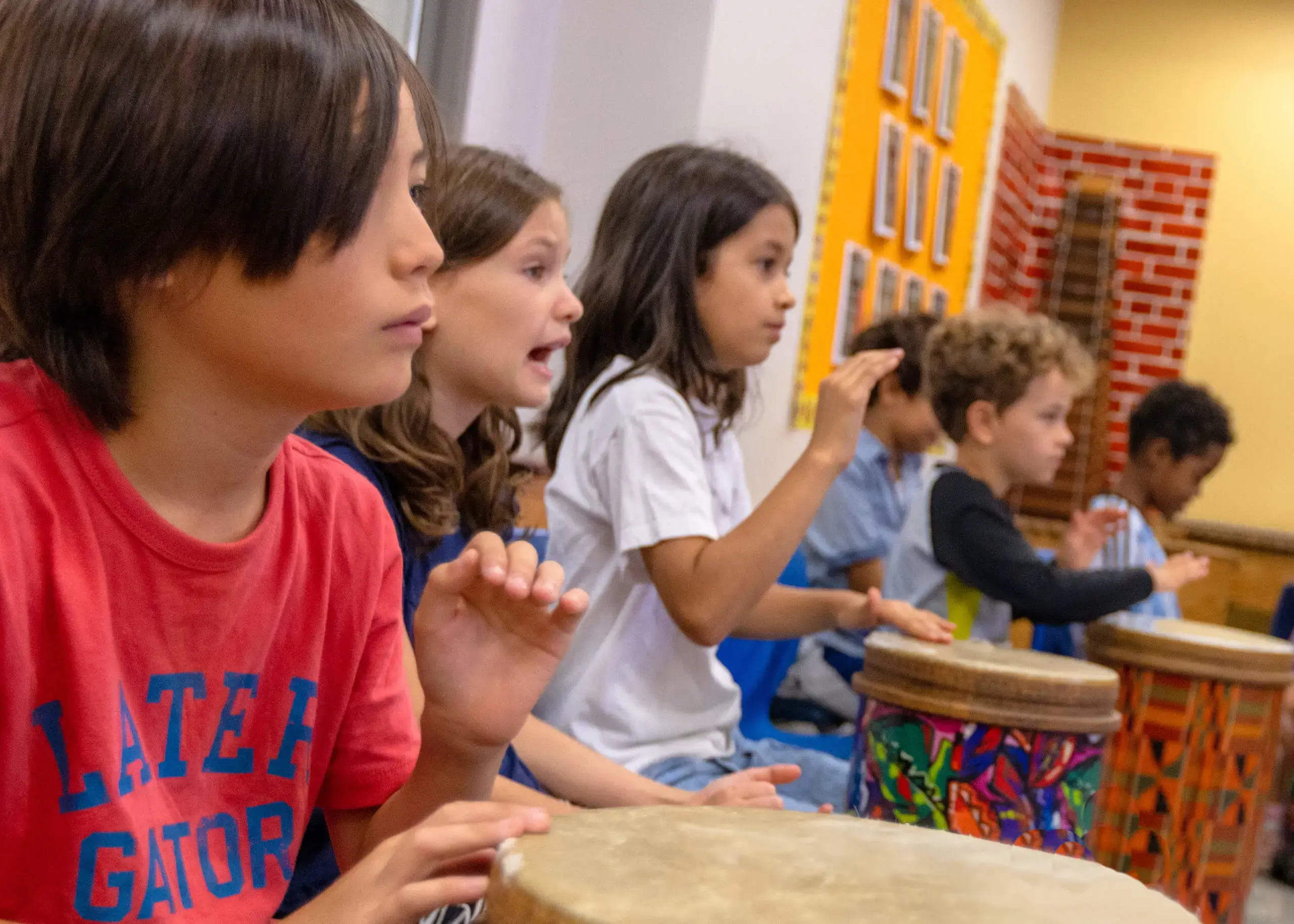 music classroom with kids playing drums