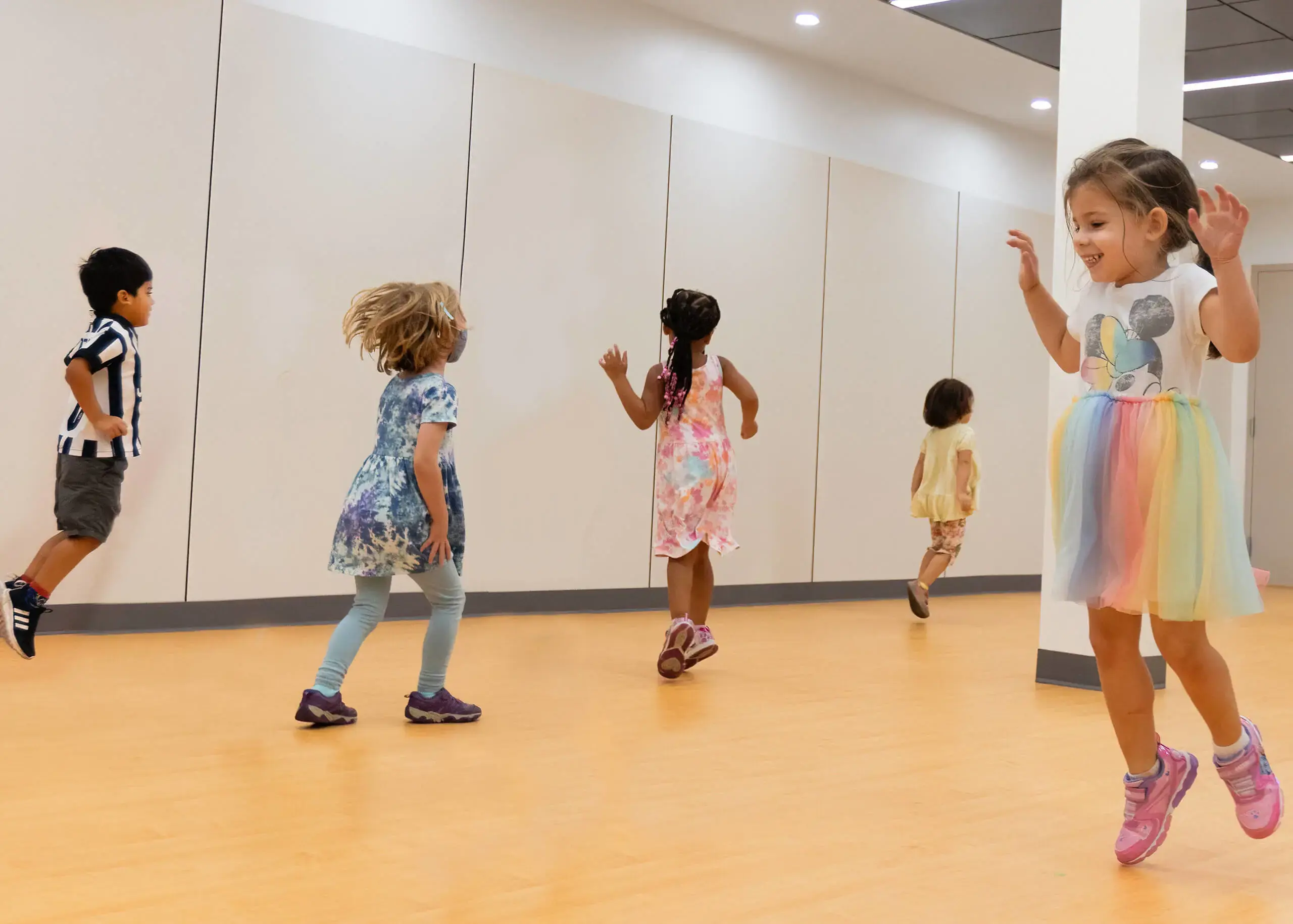 several children dancing in a room