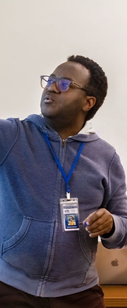 Teacher writing on a whiteboard