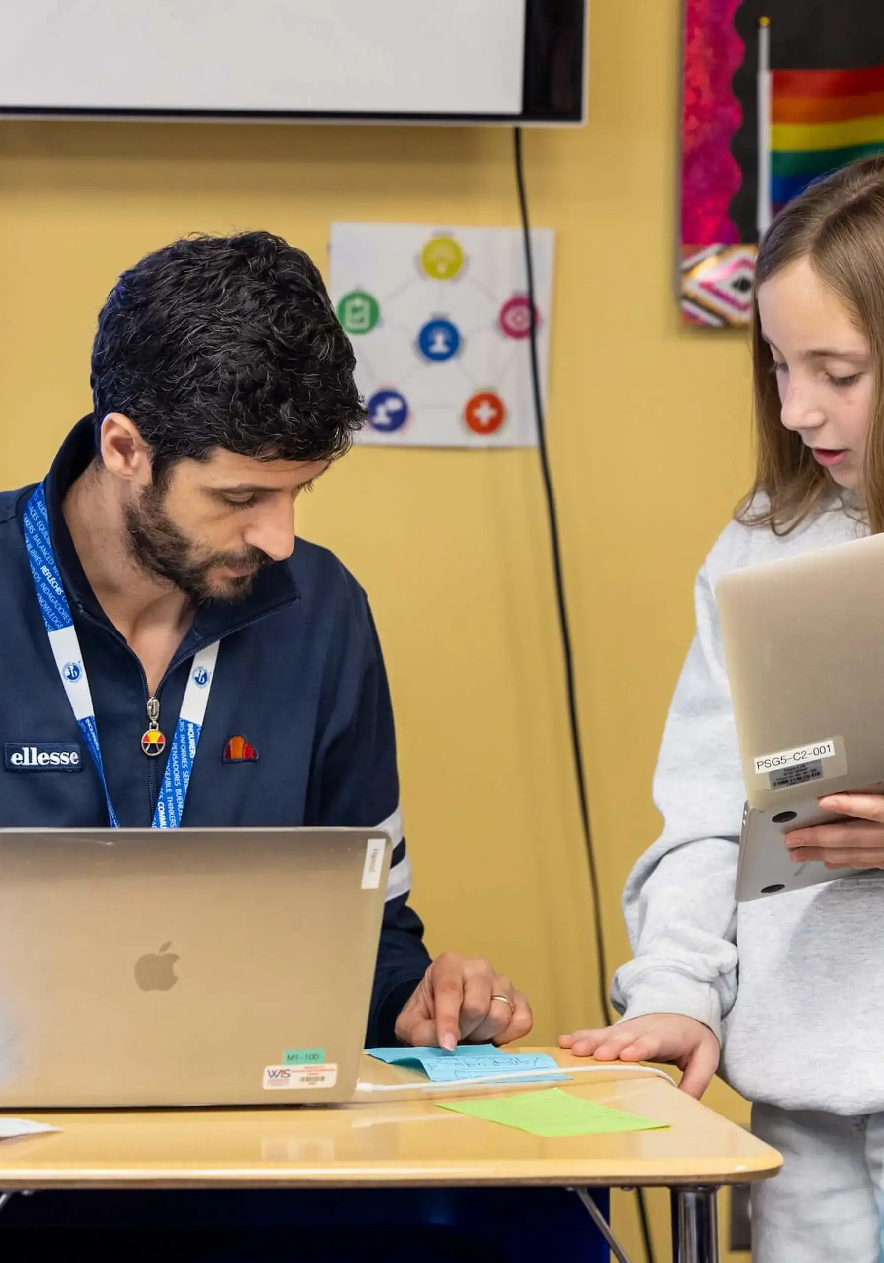 Teacher discussing work with student