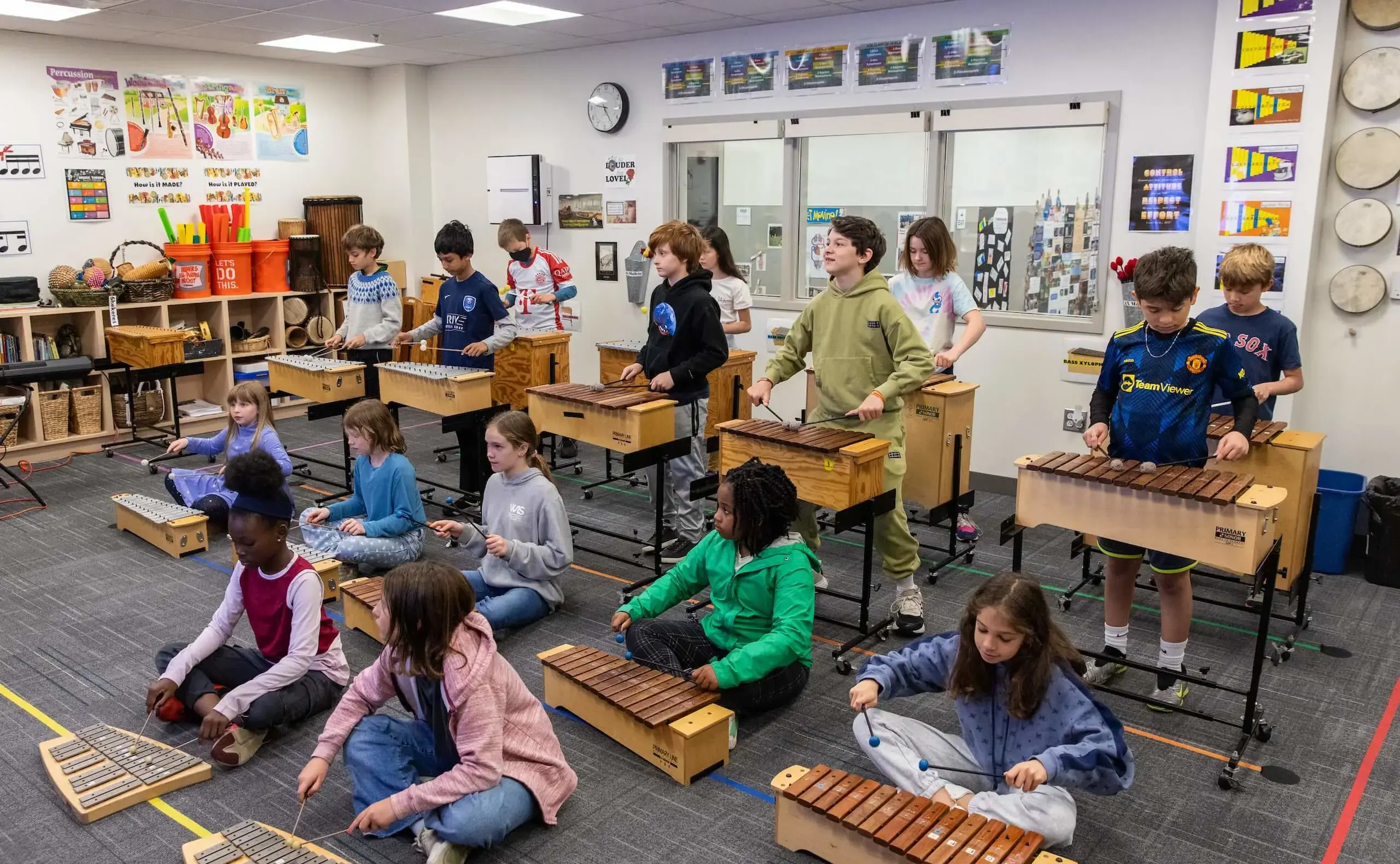 Students playing xylophones