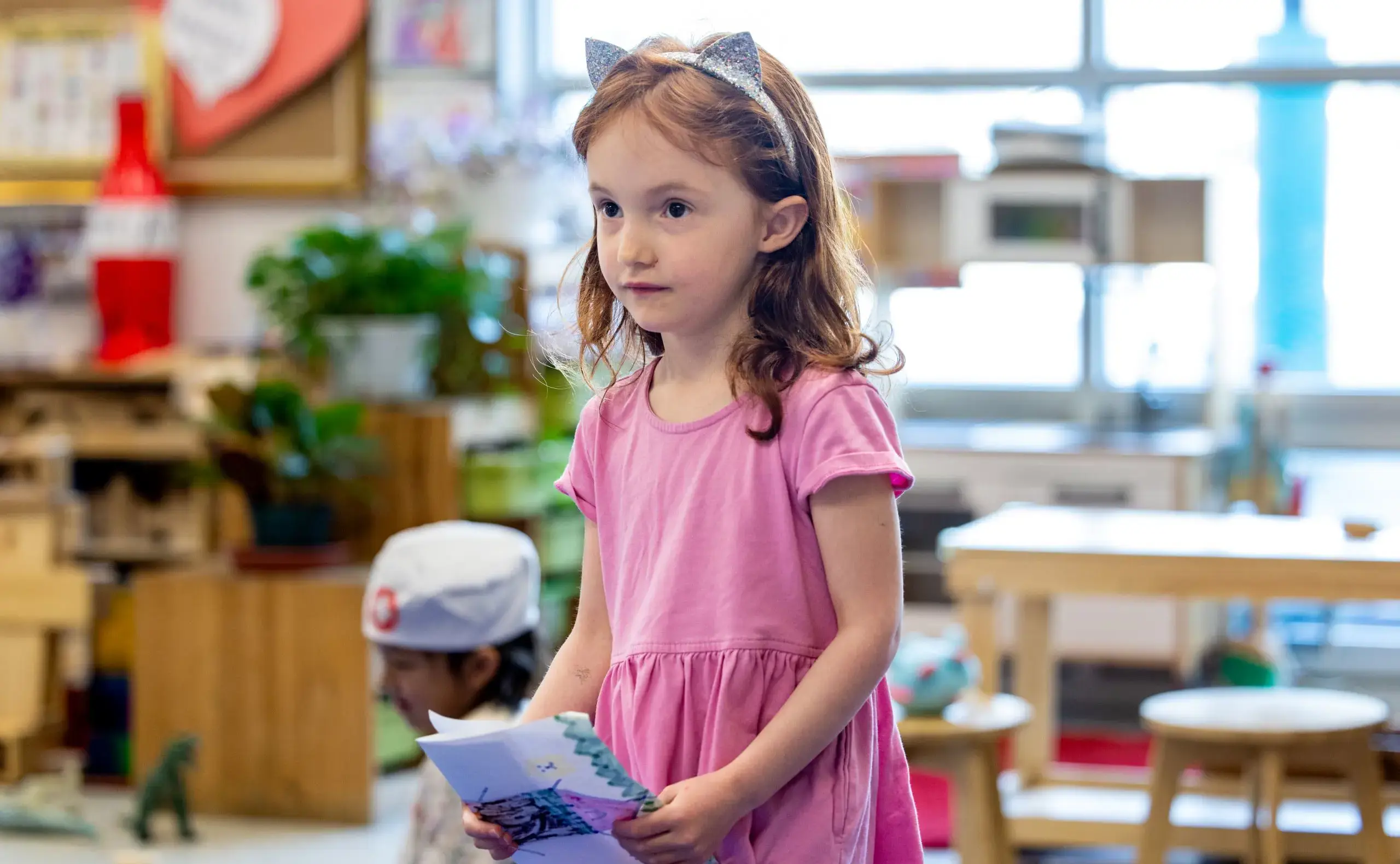 Little girl wearing cat ears