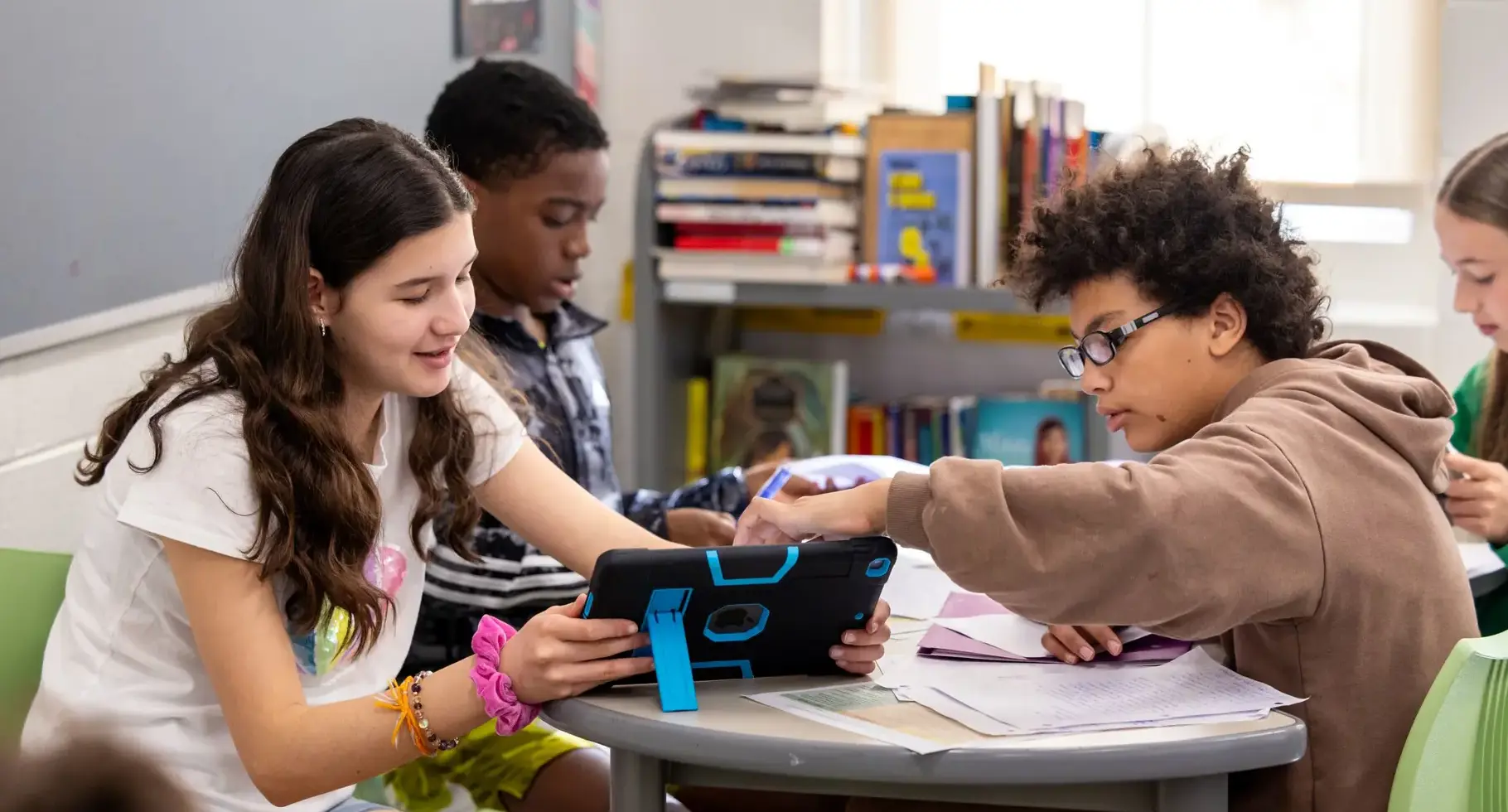 Three students in a classroom