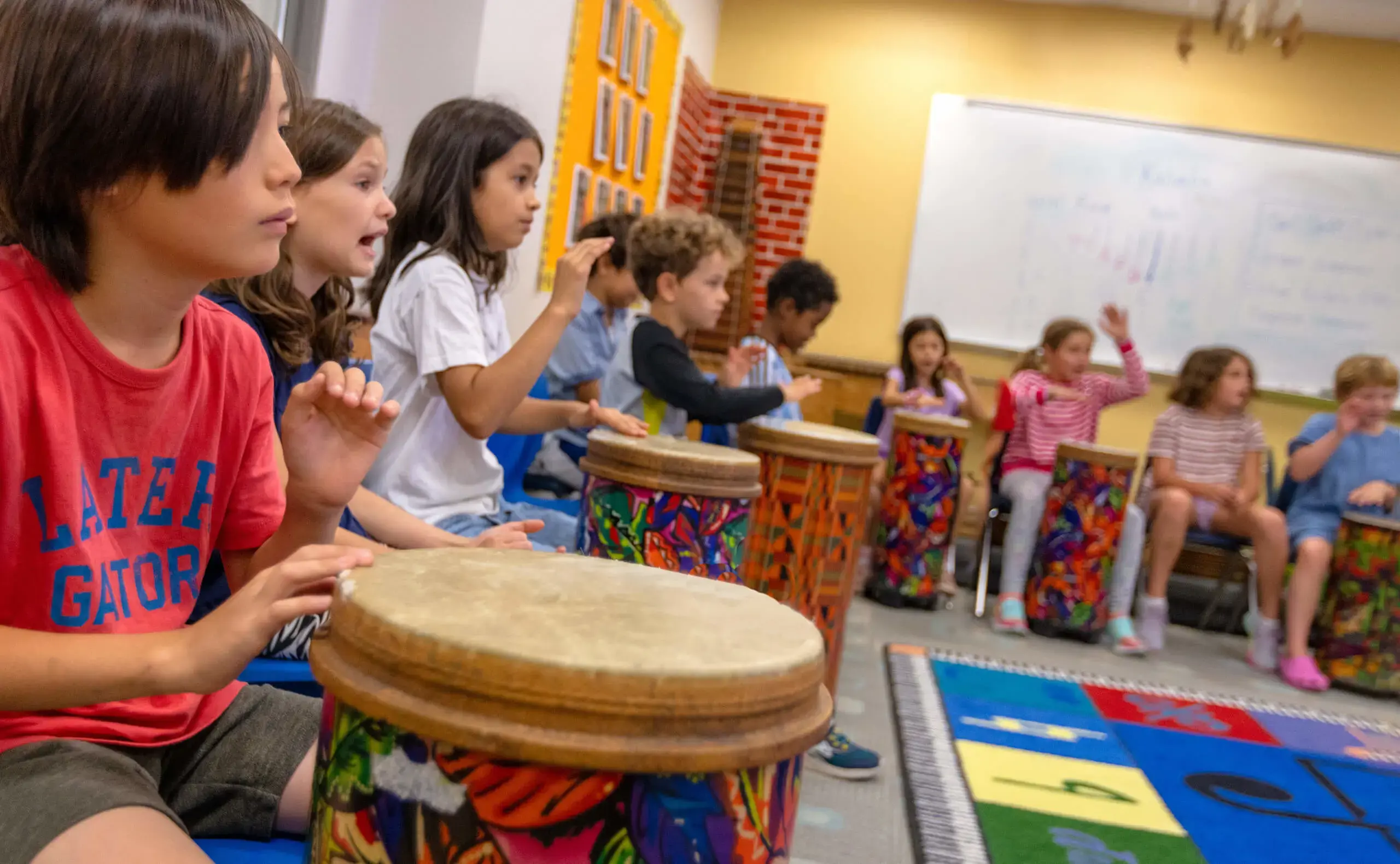 Primary students playing drums