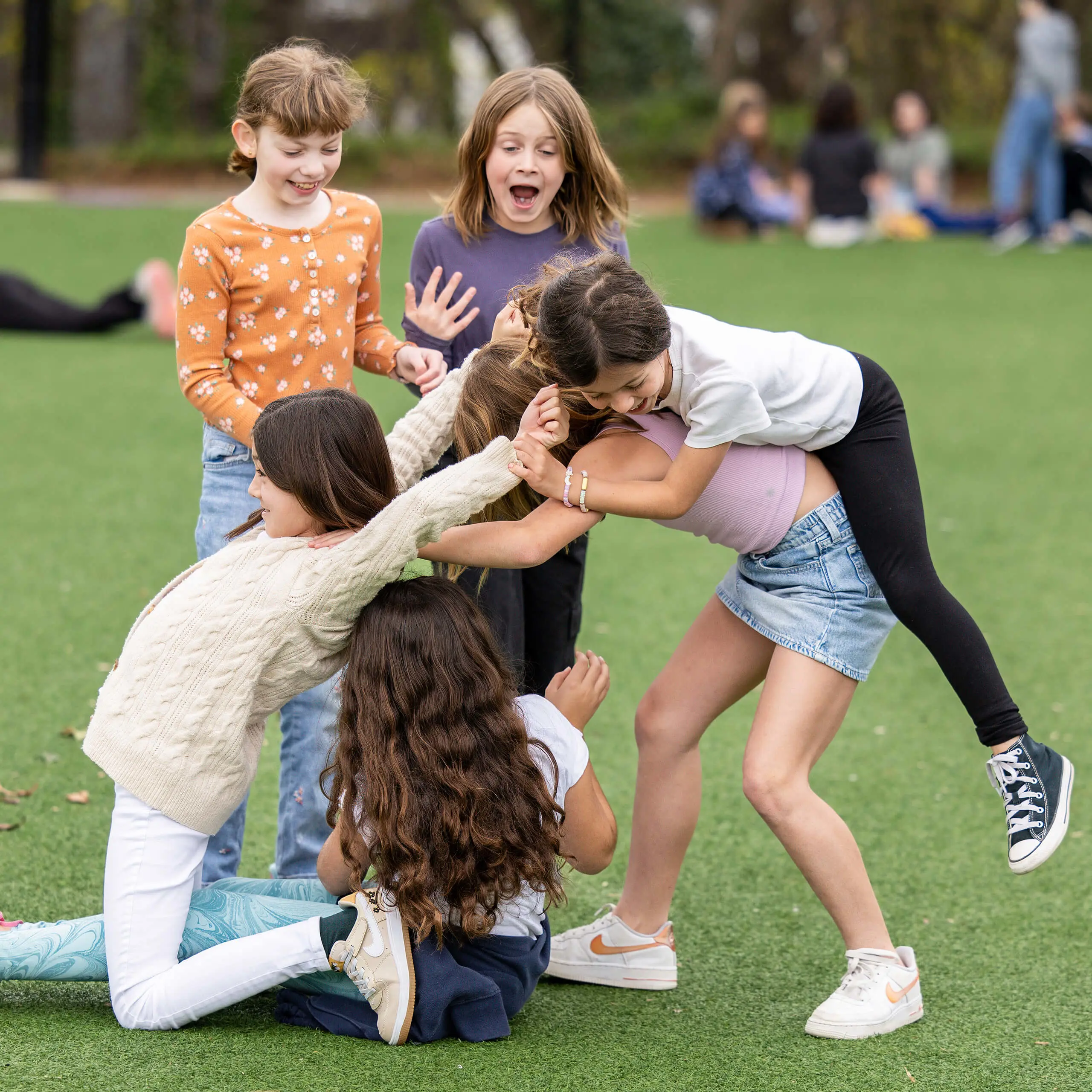 a group of girls playing outdoors