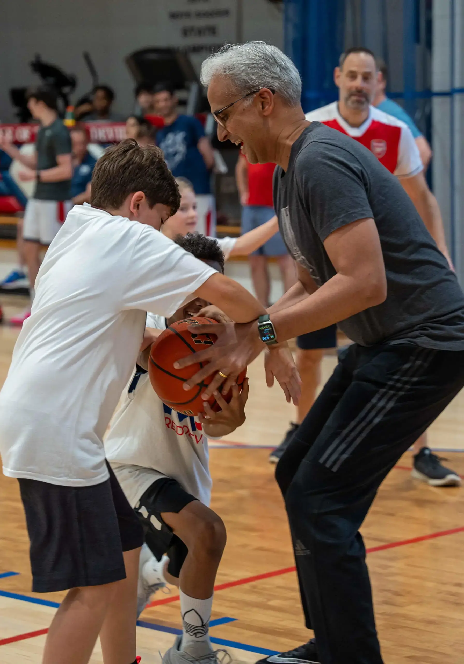 Students and teachers play basketball