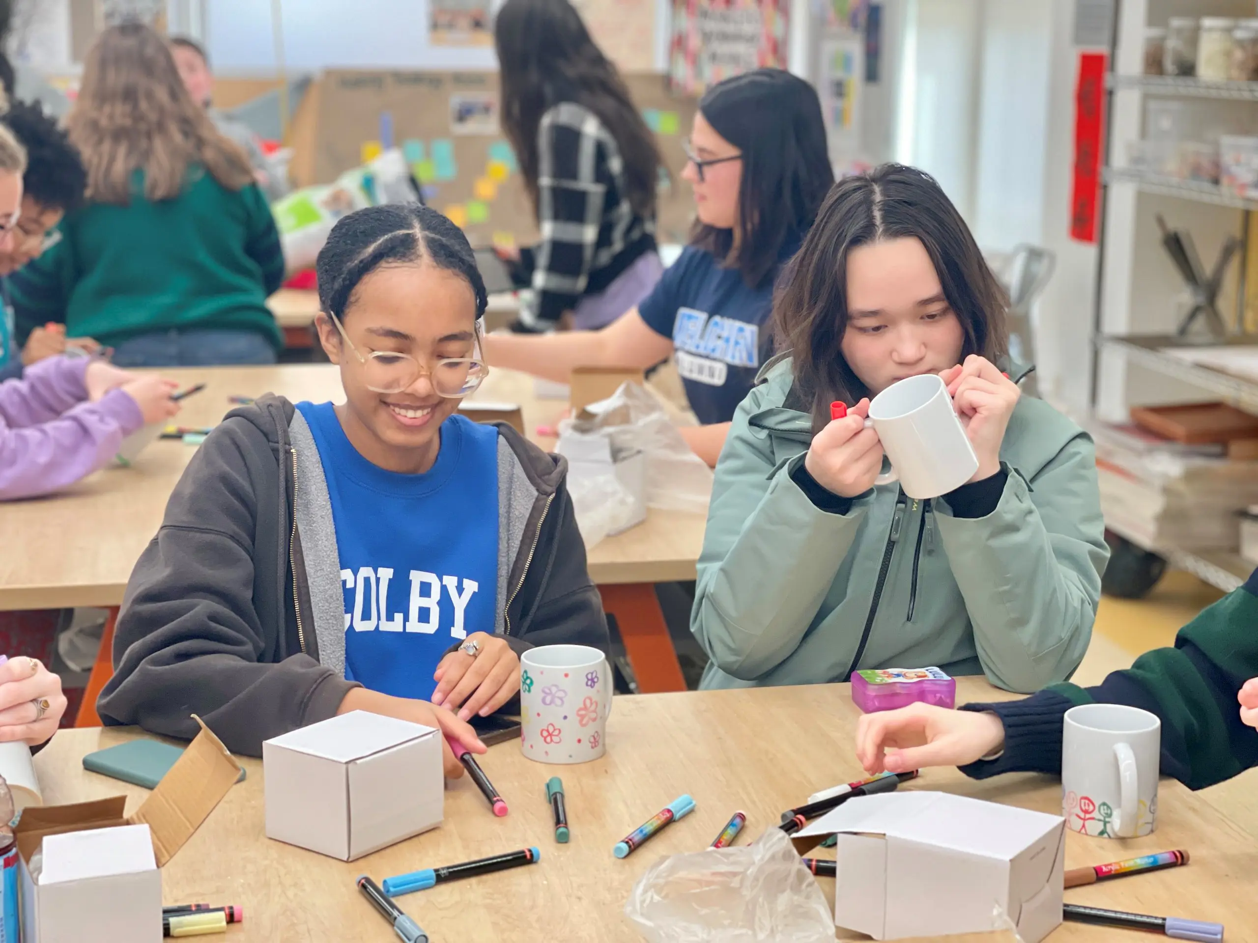 Students smiling at an art workshop