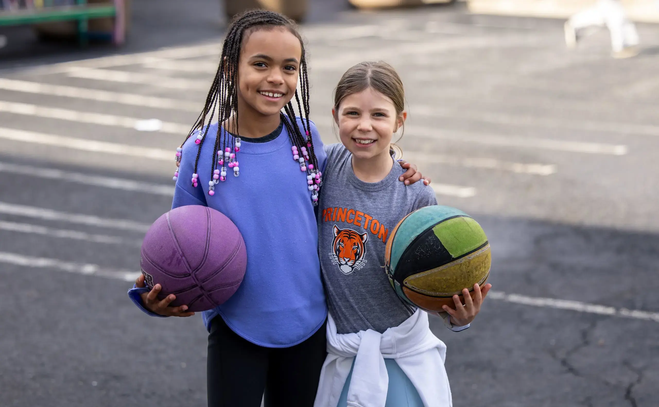 Two children with basketballs